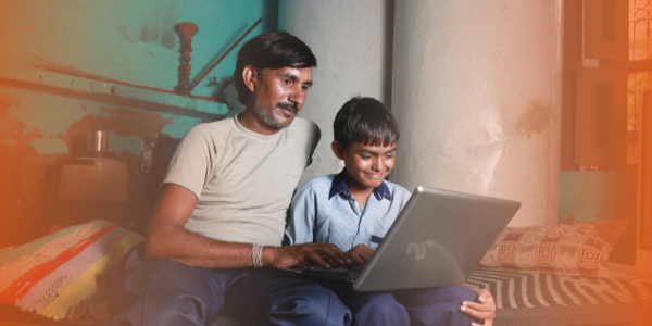 Child and parent with a laptop