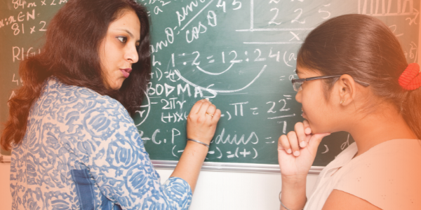 Teacher teaching a child