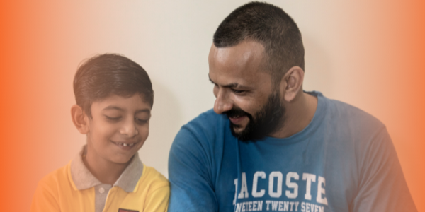 a child and parent smiling