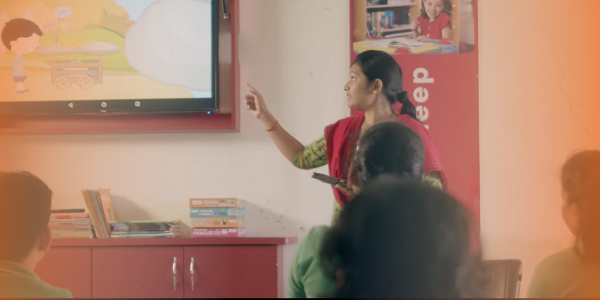 A teacher teaching in a smart classroom