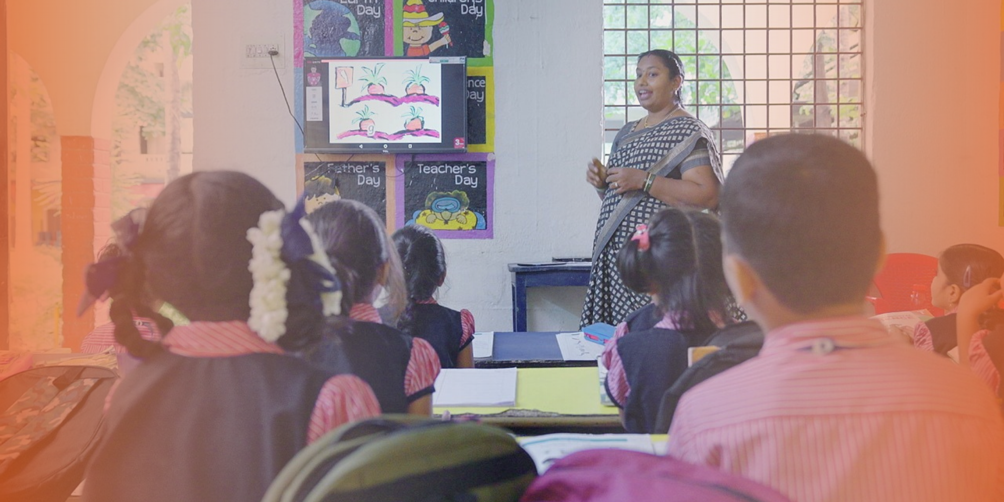 Teacher teaching her students in a smart classroom
