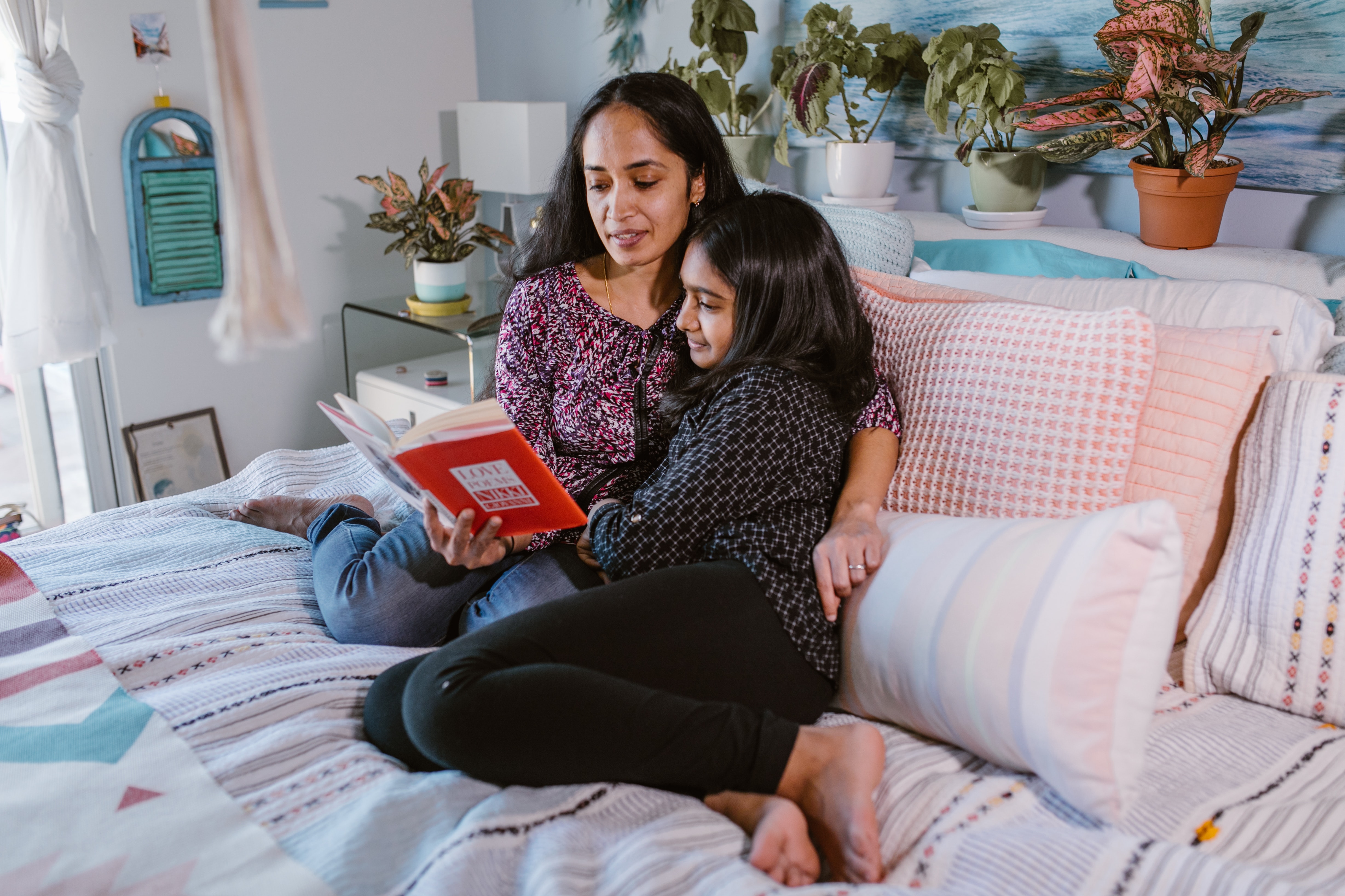 mother and child reading together